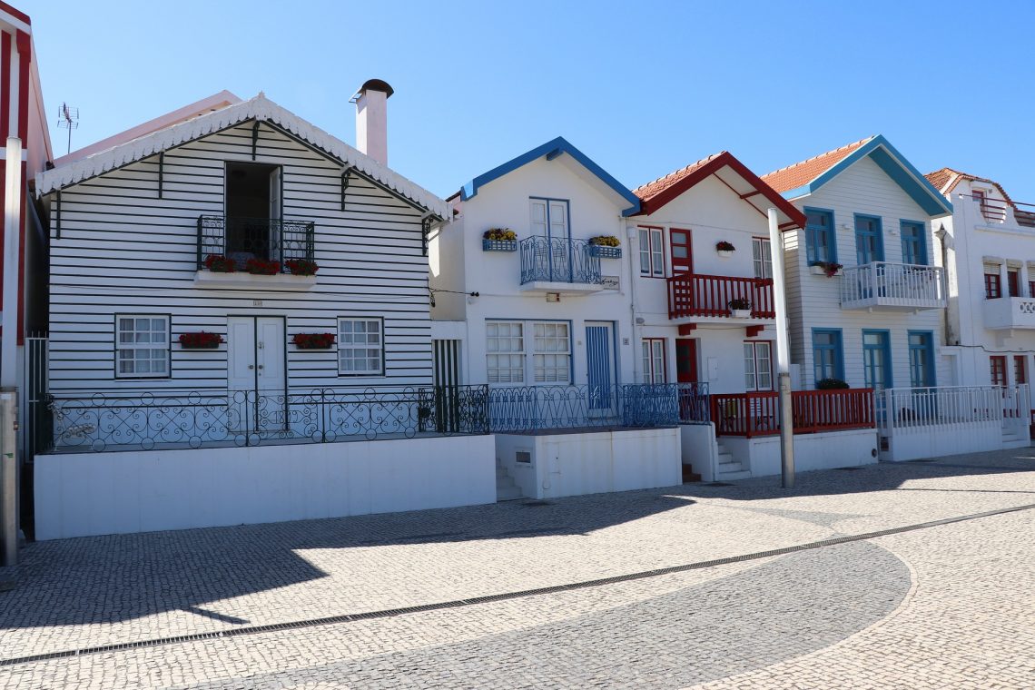 Costa Nova, Portugal: Get lost in a vibrant palette of striped houses, golden beaches, and rich cultural experiences.