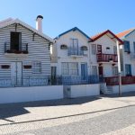 Costa Nova, Portugal: Get lost in a vibrant palette of striped houses, golden beaches, and rich cultural experiences.